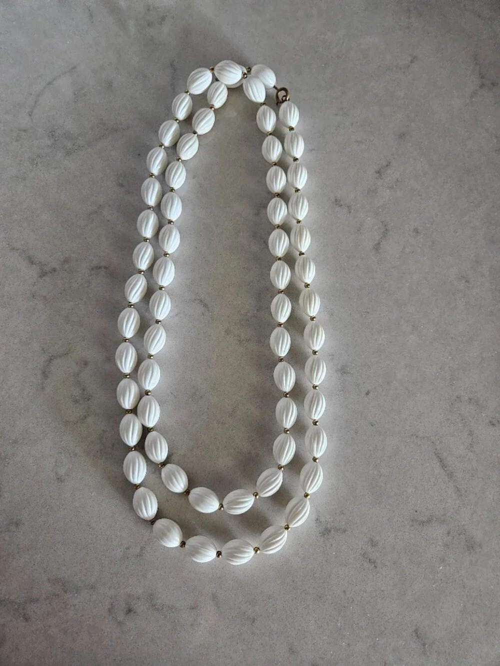 RARE AND VINTAGE WHITE RIBBED OVAL BEAD 48